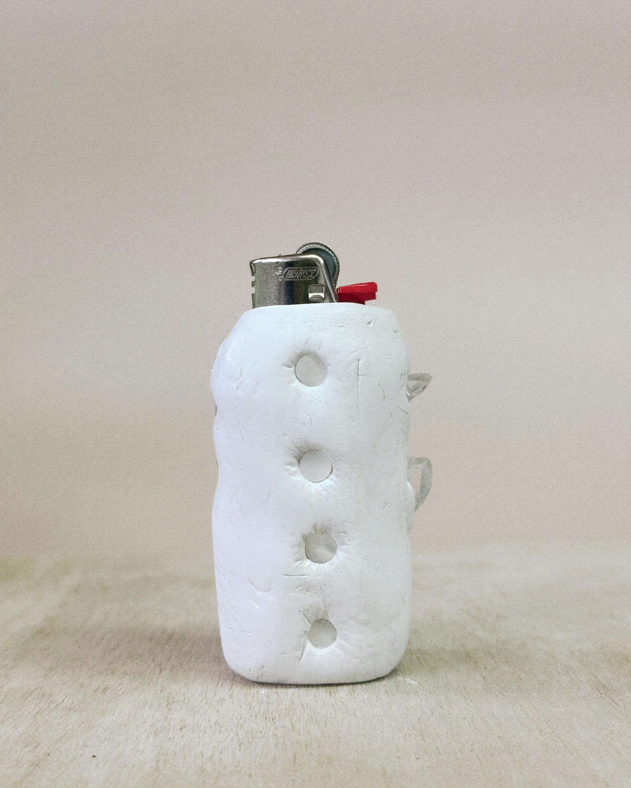 White textured lighter on a beige background