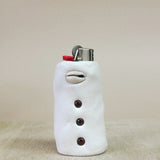 Lighter shaped cover with garnet on a beige background