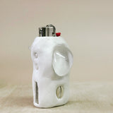 White shaped lighter on a beige background