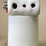 White ceramic light object on candle on a beige background