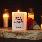 paloma candle sitting on a altar